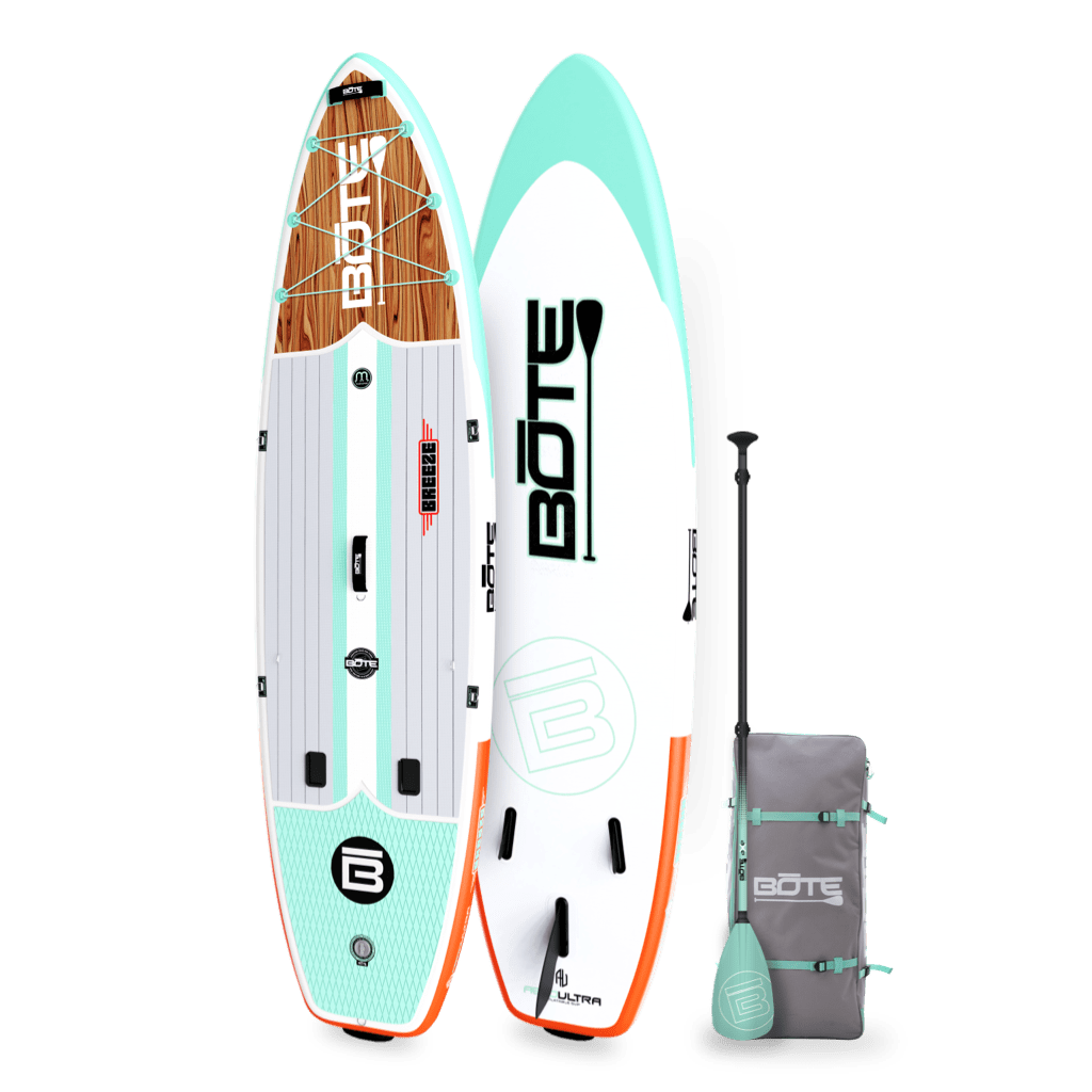 Angled view of the Breeze Aero 11'6" Classic Mangrove Inflatable Paddle Board with bag and paddle