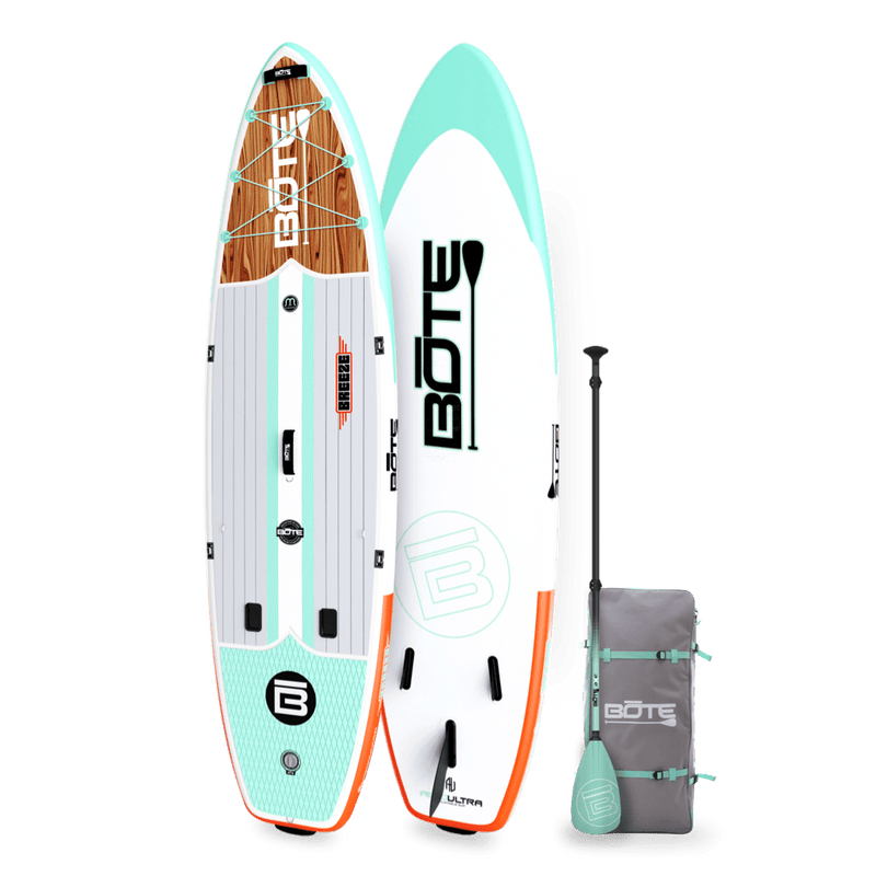 Angled view of the Breeze Aero 11'6" Classic Mangrove Inflatable Paddle Board with bag and paddle