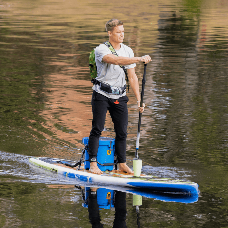 A guy paddling on the HD 12′ Native Nalu Paddle Board