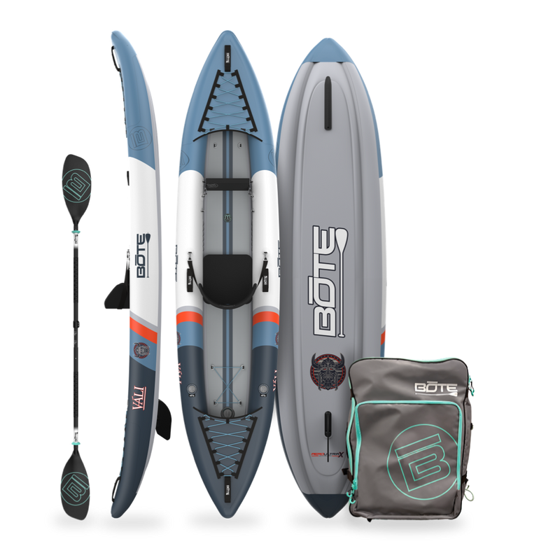 Inflatable kayak with paddle and carrying bag on a white background