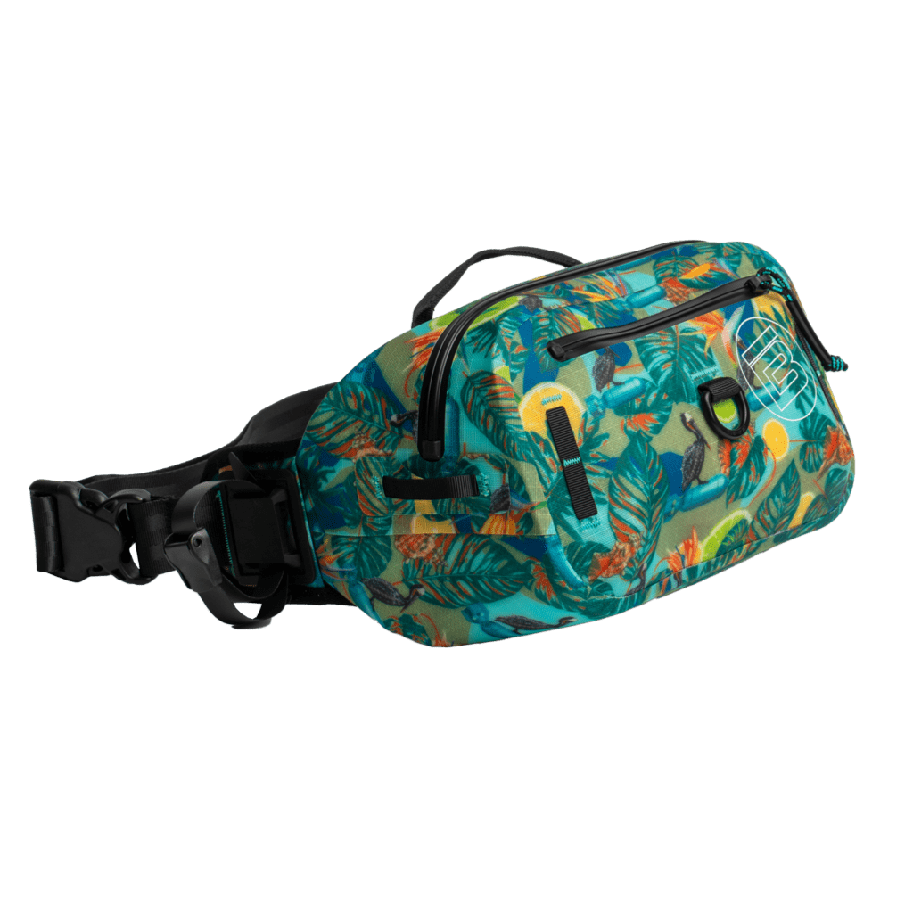 Angled view of Native Bombardier belt pack showing front pocket and bold tropical print.