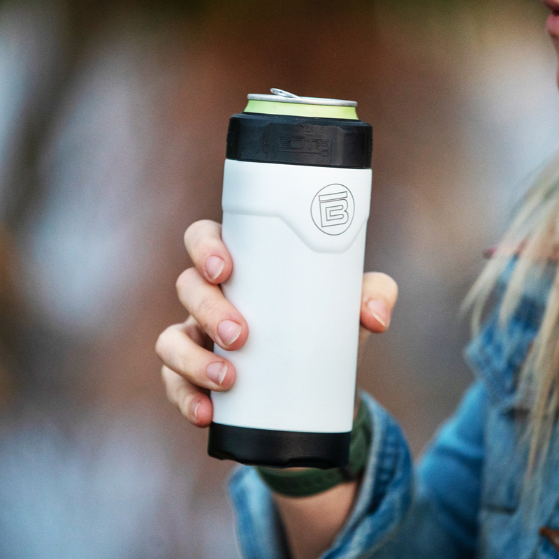 A person holding a MAGNEChill Can Cooler Slim White