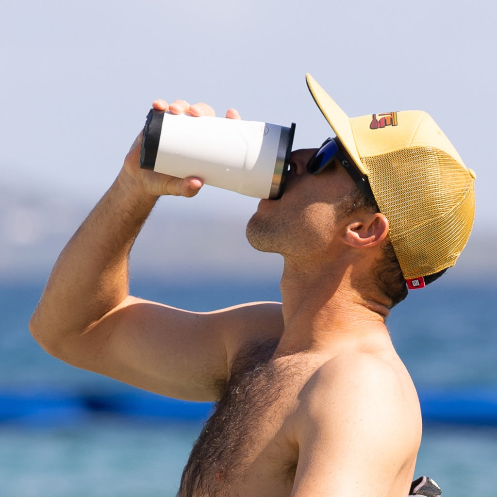 A guy drinking from a MAGNETumbler 20oz with Lid White