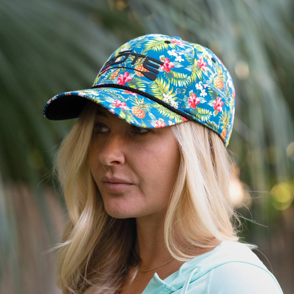 Person wearing the BOTE Native Cuda Ripstop Hat with Hawiian Print and black BOTE logo.