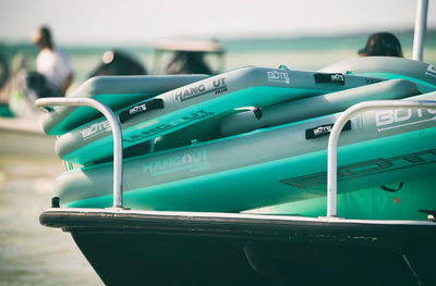 Stacked FLOATubes secured on a boat, showing durable design and compact storage.