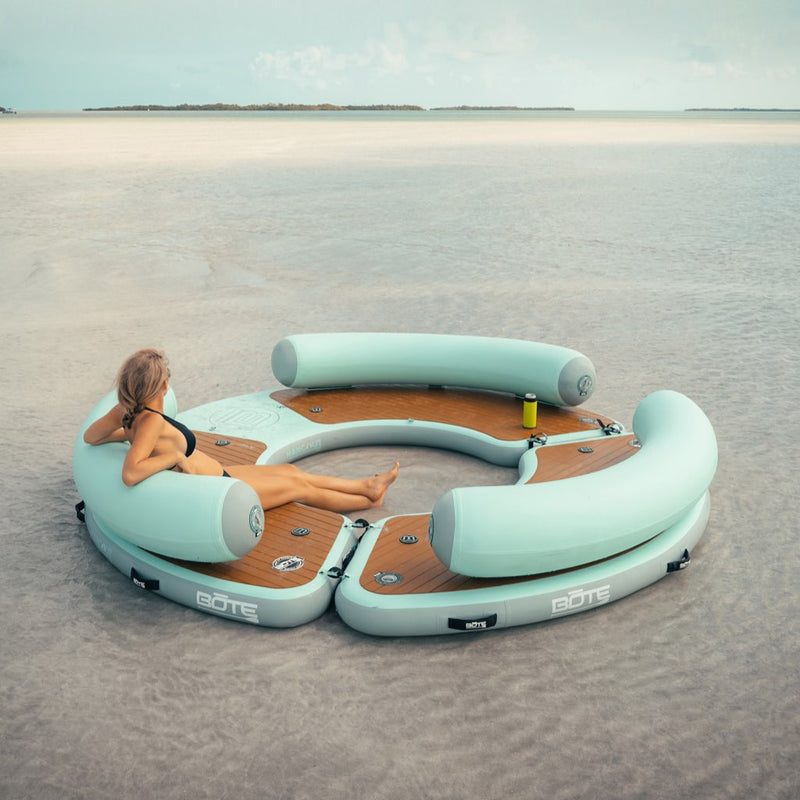 Picture of a woman sitting on the Inflatable Dock Hangout 360 Duo