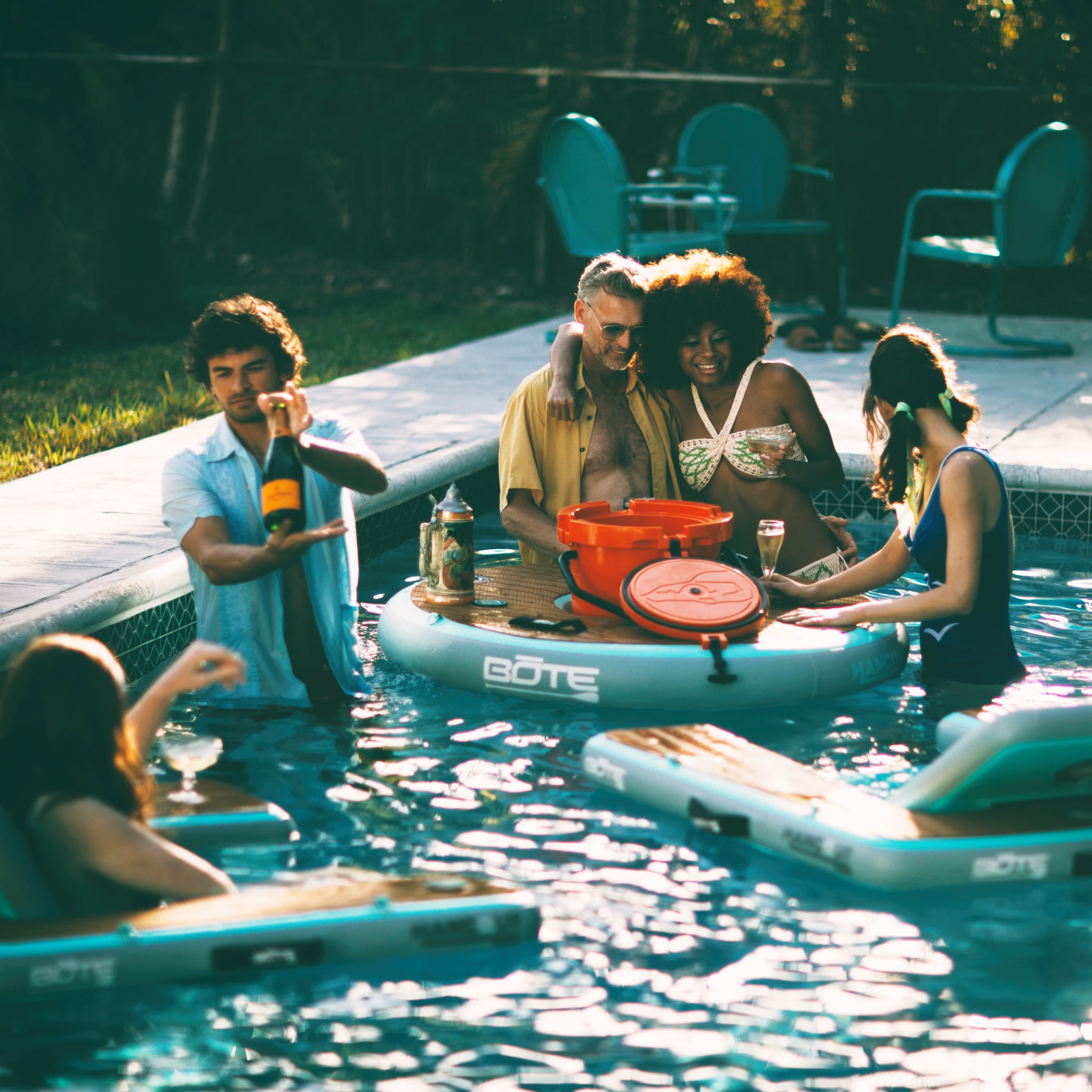People hanging out in the pool with Inflatable Hangout Chair Bar Solo