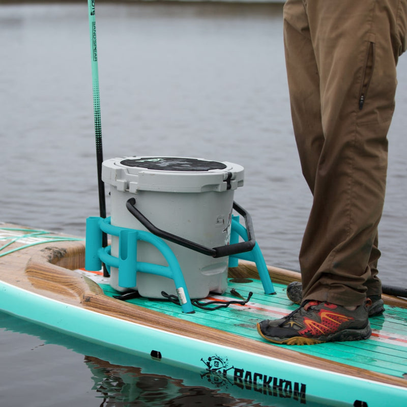 Bucket Rac Pelagic mounted on a paddle board with a gray KULA 5 cooler, shown in use on water.