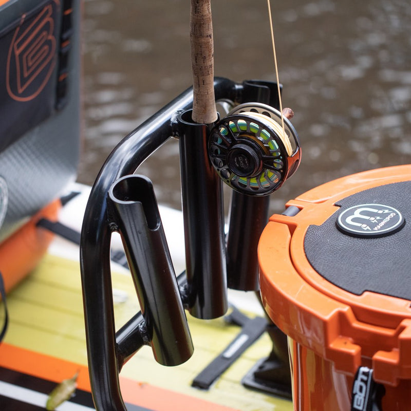 Mini Rocket Rac Black mounted on paddle board with fishing rod inserted.