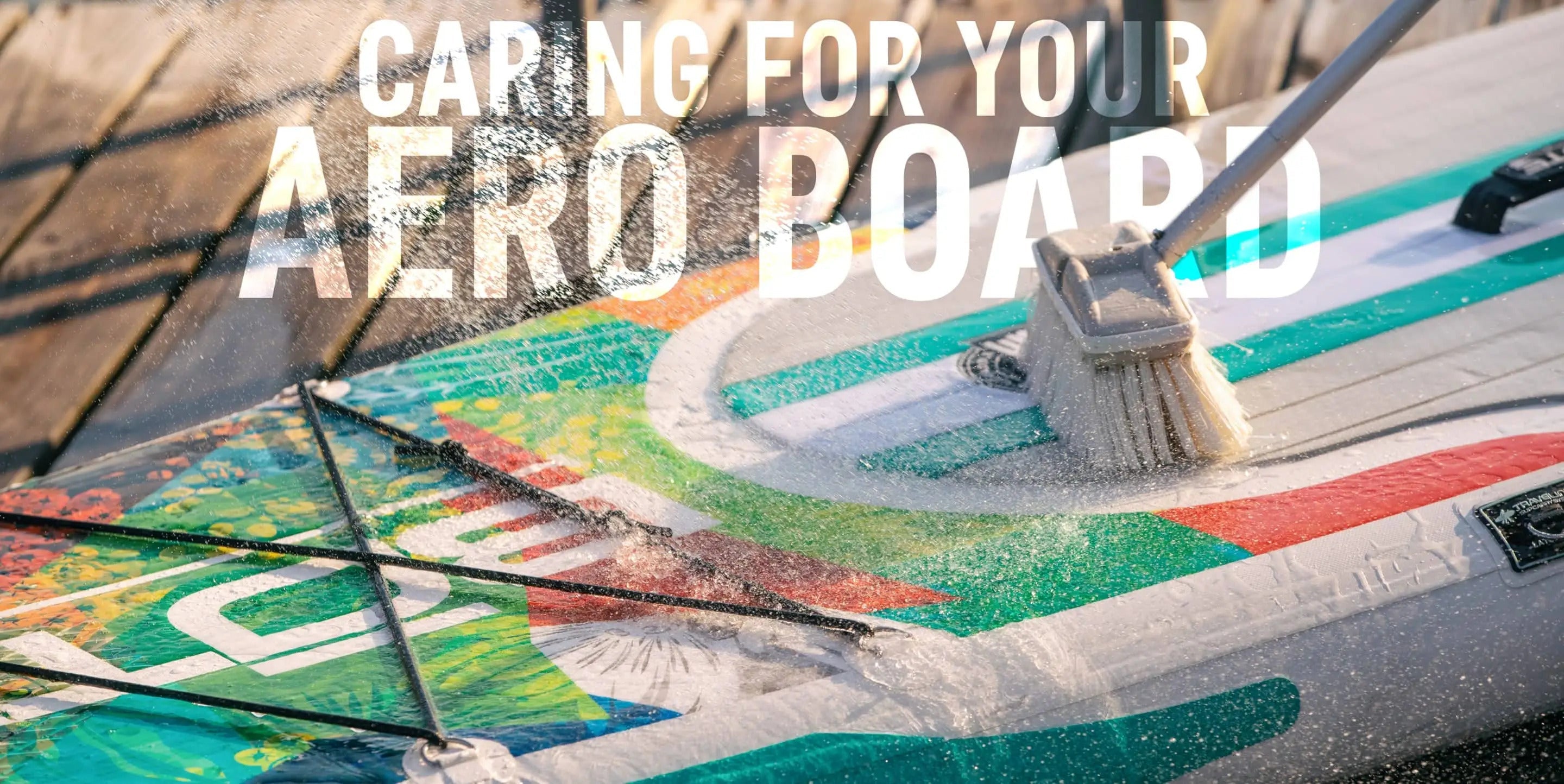 Someone is cleaning their Aero Inflatable paddle board with a brush, soap and water with text overlay saying " CARING FOR YOUR AERO BOARD"