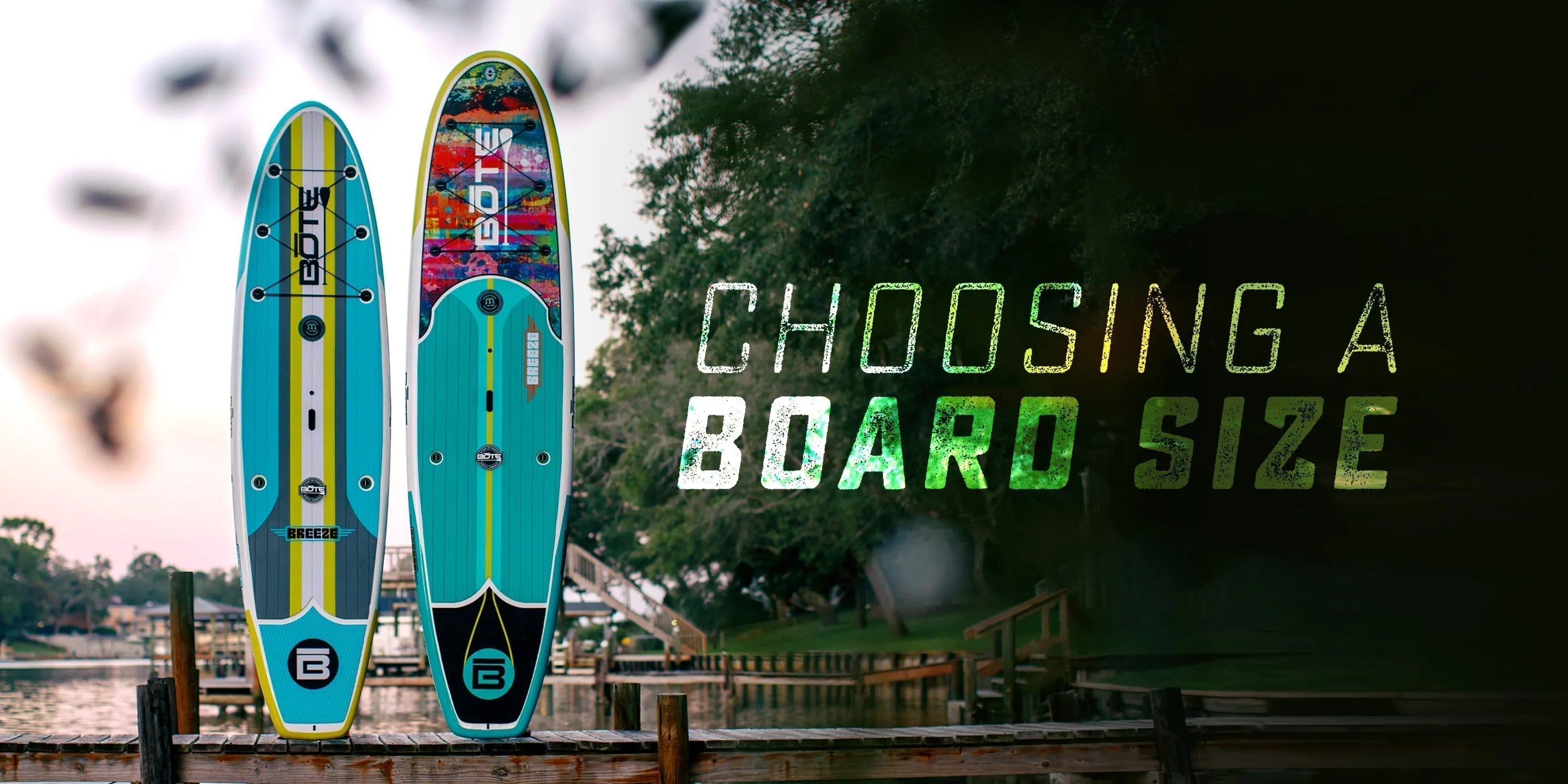 Two paddleboards standing up with wording that says "Choosing a board size"