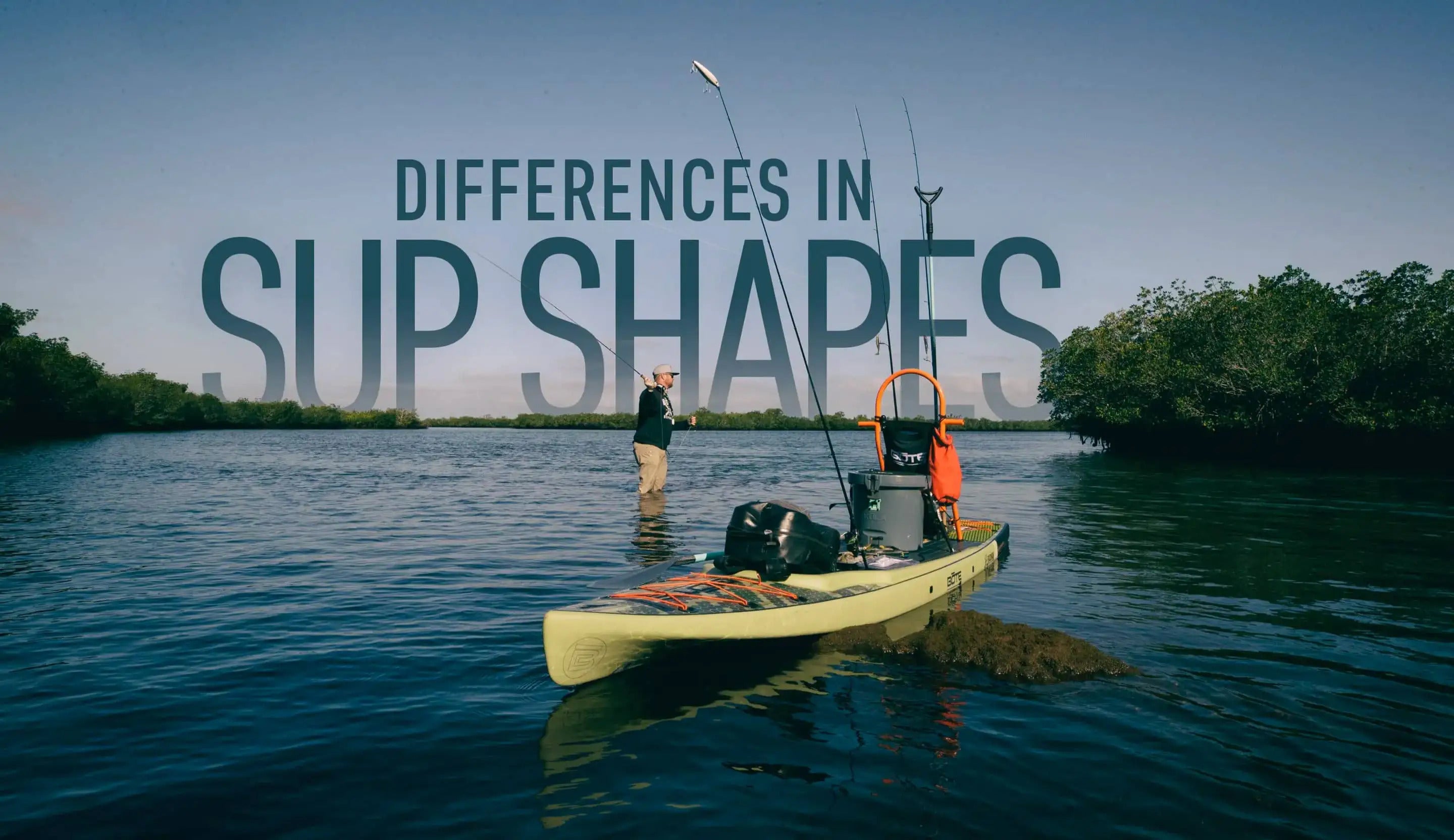 Fisherman standing in the water next to his paddleboard casting for fish. the paddleboard has a Kula and Rac system on it for easy paddling. There is text overlay that says "Differences in SUP shapes"