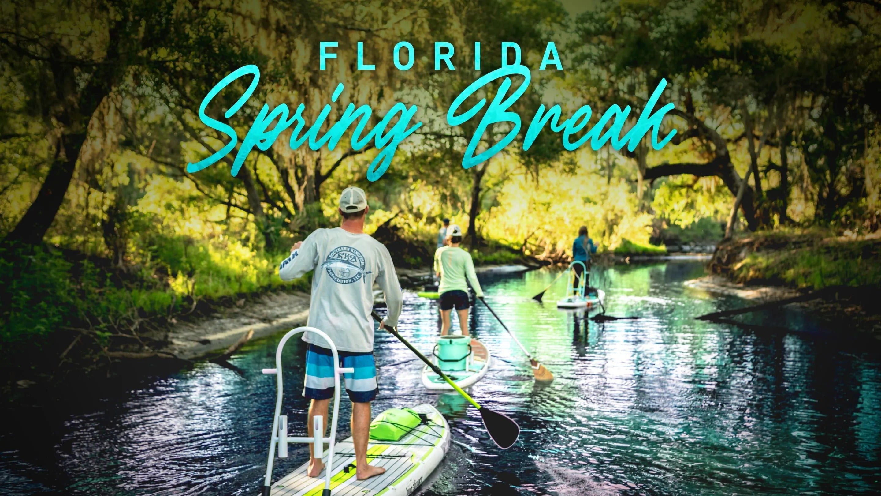 Three people paddling down a calm river in Florida under trees with a text overlay that states " FLORIDA: SPRING BREAK"