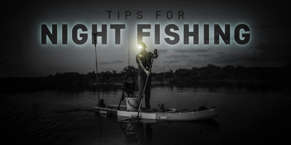 Paddleboarder on the water at night wearing a head lamp going out for an adventure. The words " Tips for night fishing" are overlayed