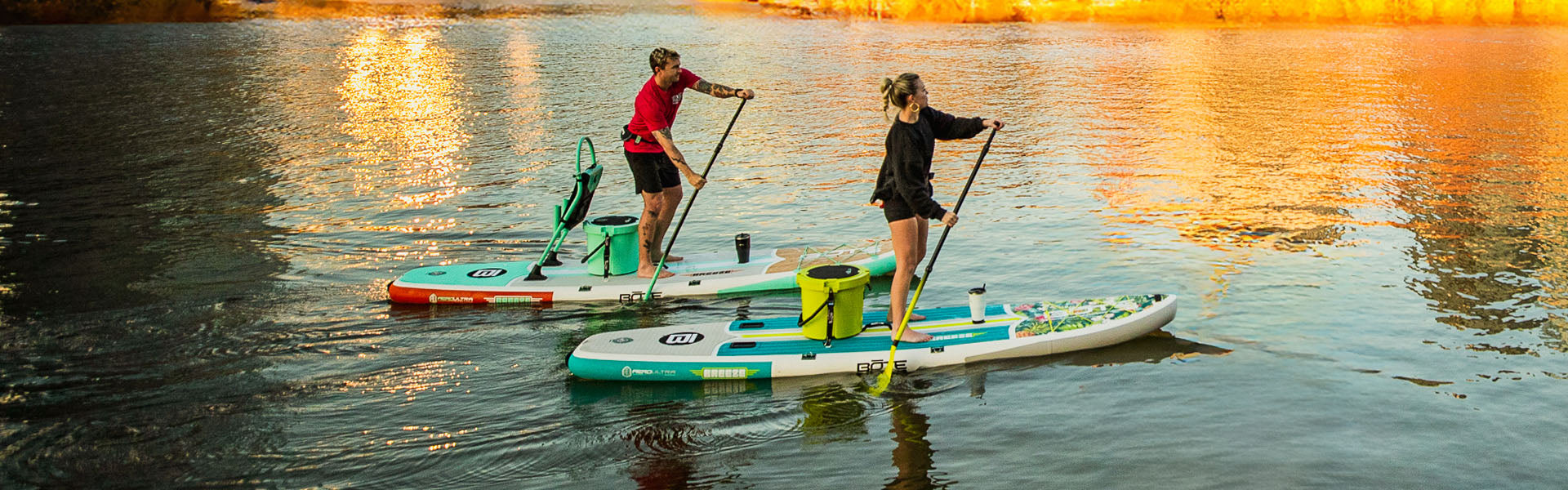 Two people paddling on BOTE Inflatable Paddle Boards