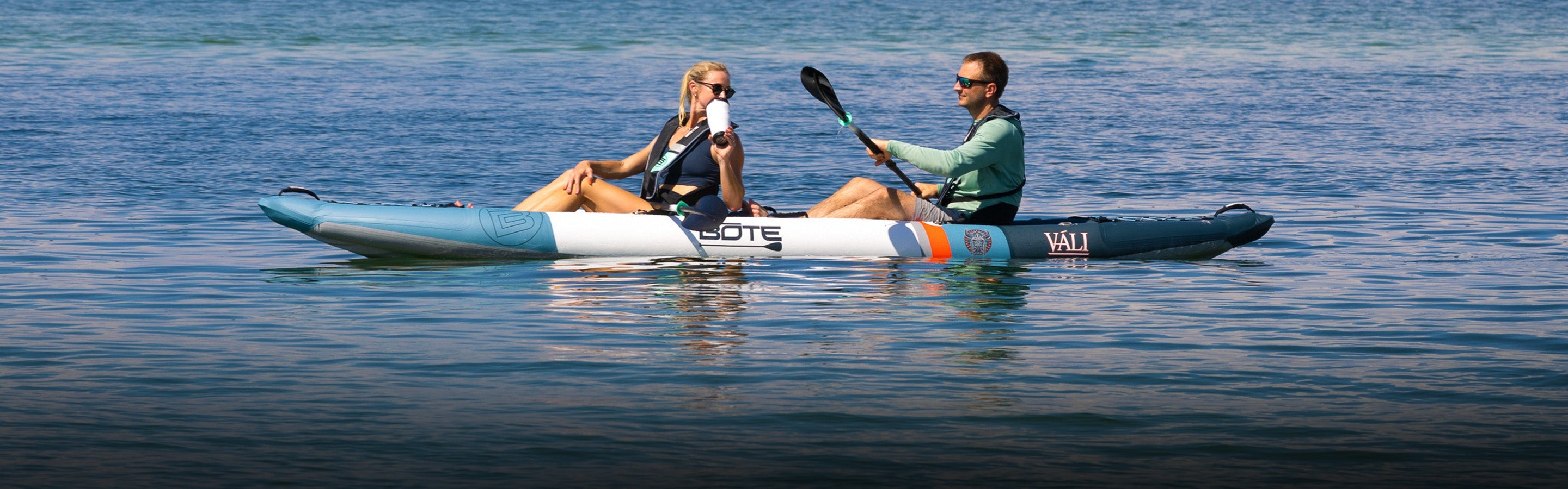 Man and dog on a BOTE Zeppelin Aero Inflatable Kayak