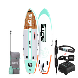 Breeze Aero Package inflatable paddle board with woodgrain deck, paddle, carry bag, leash, and pump.