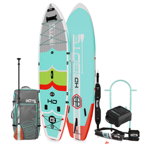 HD Aero Package shown with inflatable paddle board, teal deck, paddle, carry bag, leash, and pump.