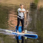 A guy paddling on the HD 12′ Native Nalu Paddle Board