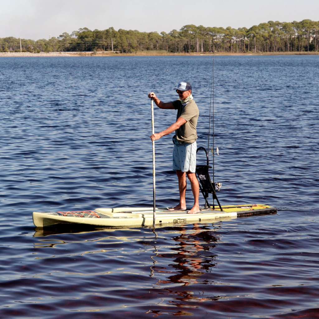 A guy paddling on Rackham Verge Paddle Board