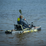 A guy sitting and paddling in a Rackham Aero 12′4″ Verge Camo Inflatable Paddle Board
