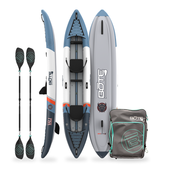 Inflatable kayak with paddles and a carrying bag on a white background