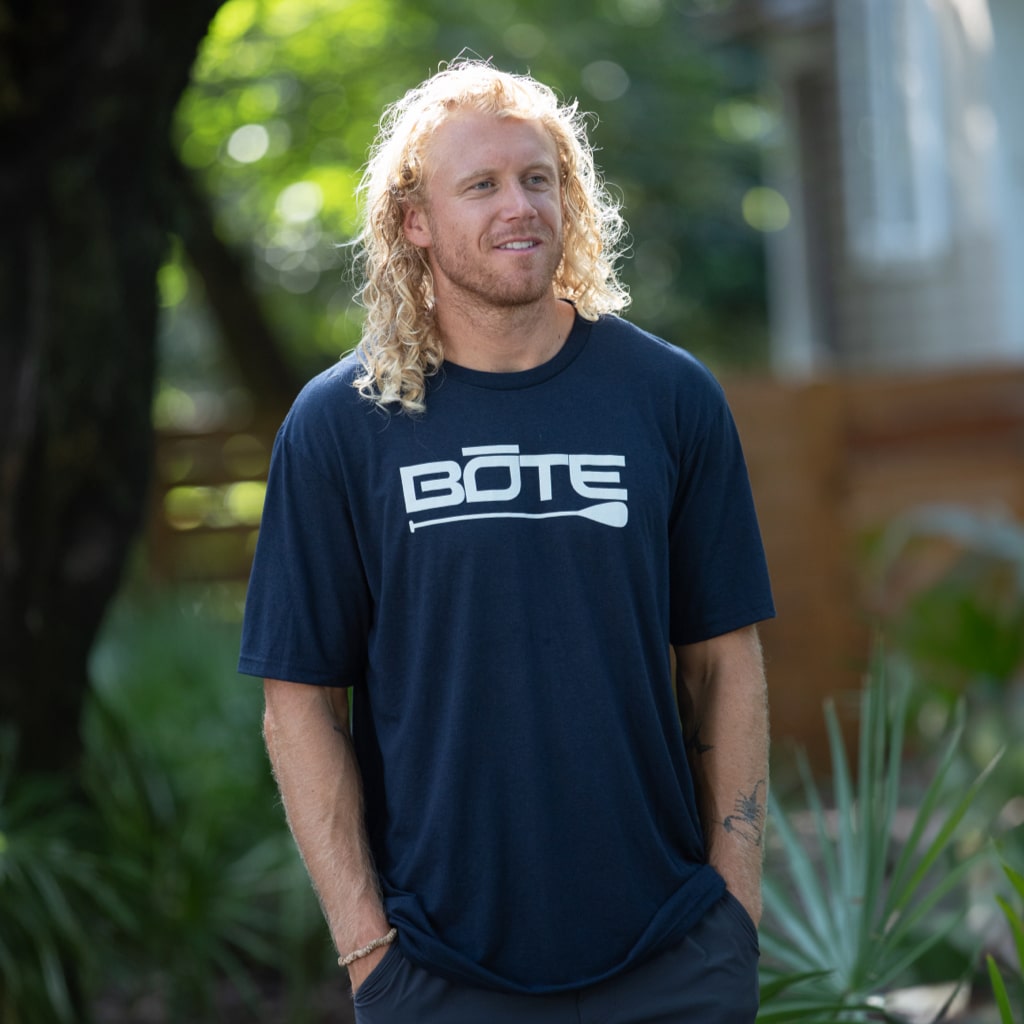 Image of man wearing Men's Logo Navy Tee Shirt