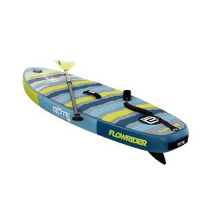 Angled rear-left view showing Kids FlowRider paddle board with paddle across deck.