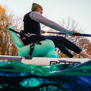 Woman paddling on an Aero SUP Paddle Seat.