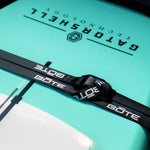 Closeup view of the BOTE Cam Straps across a paddle board