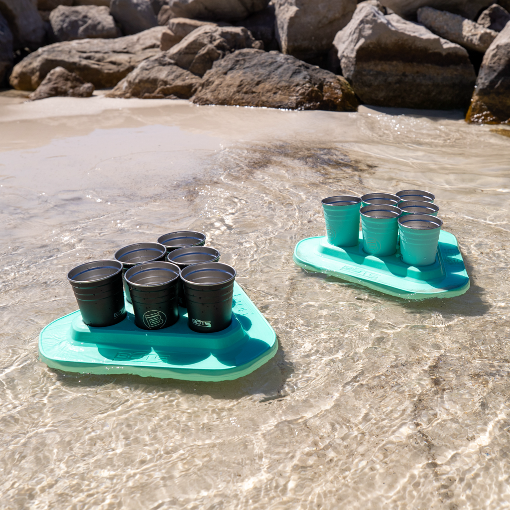 Two BOTE Pong Classic sets floating in the water