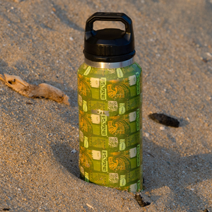 MAGNEBottle 36oz in tribal Nalu print standing upright in beach sand.