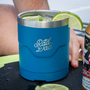 A drink in the Rad Dad Limited Edition Lowball on top of a KULA cooler