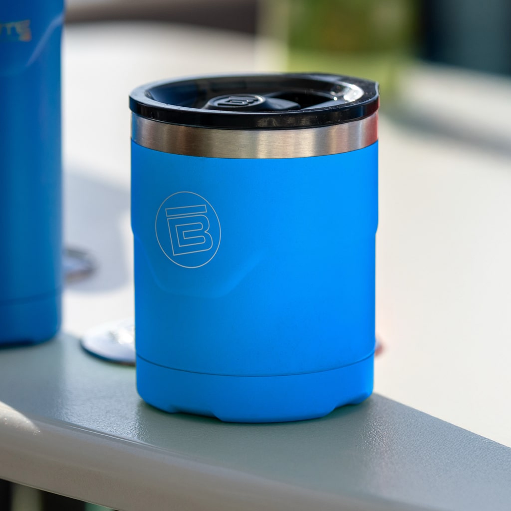 Lifestyle view of the MAGNETumbler 12oz Lowball with Lid Harbor Blue on a table