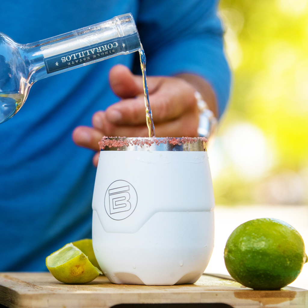 A drink being poured into a MAGNETumbler 12oz Stemless with Lid White