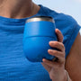 A person holding a MAGNETumbler 12oz Stemless with Lid Harbor Blue