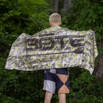 Man draping towel on back