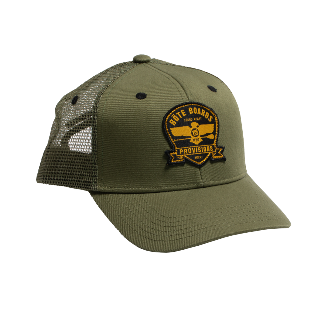 Front view of Eagle Supply Trucker Hat in Green with black and yellow logo with eagle holding a paddle.