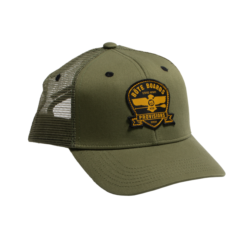 Front view of Eagle Supply Trucker Hat in Green with black and yellow logo with eagle holding a paddle.