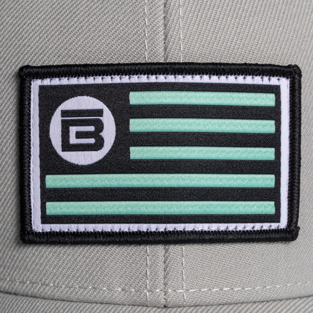 Closeup of BOTE Nation Flag Hat Gray in Grey seafoam green, white and black patch.