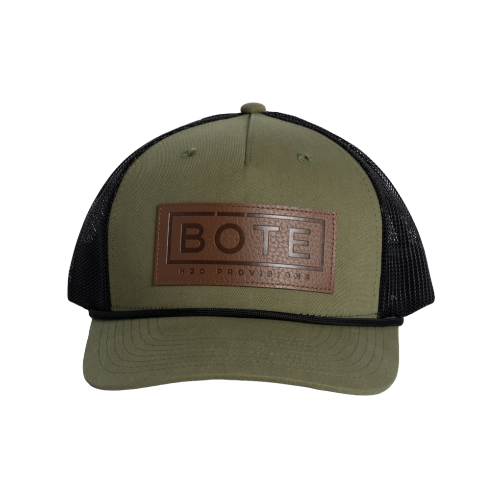 Front view of the BOTE Boxed Logo Hat with brown Patch in dark green.