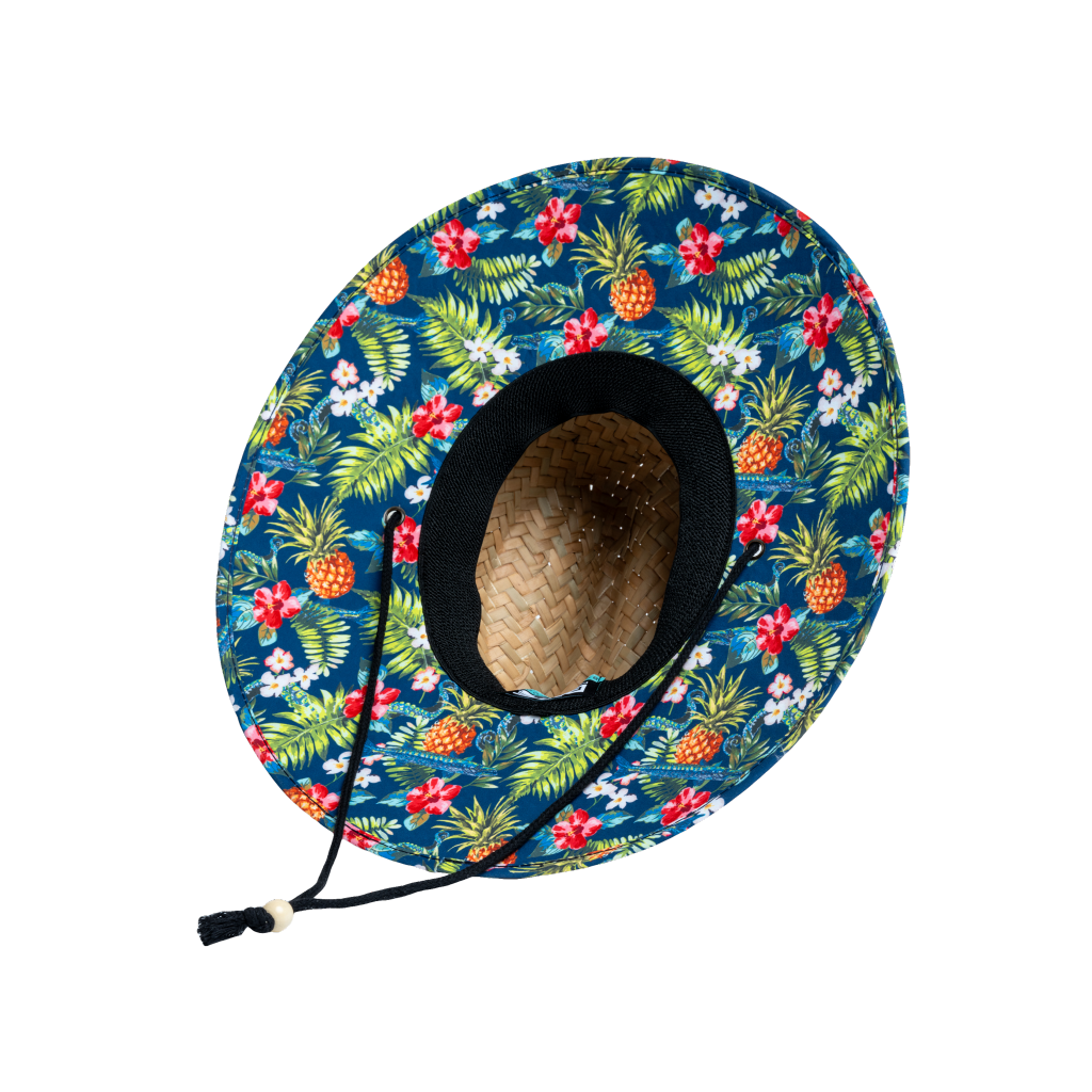 View from beneath the BOTE Native Cuda Straw Hat with Hawaiian print design on the underside of the brim and a black drawstring.