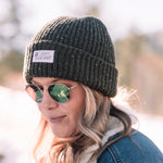 Front view of person wearing the BOTE Trademark Beanie in green