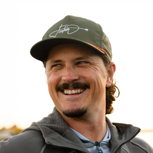 A guy wearing a BOTE Fischer Snapback Hat
