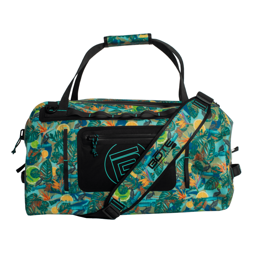 Front view of Highwater Duffel Native Bombardier with strap and tropical print design.