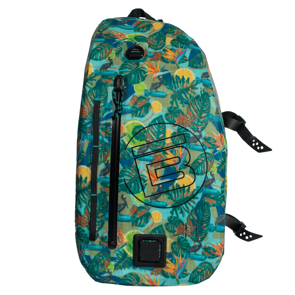 Front view of Highwater Slingpack Native Bombardier with bold B logo and tropical print.