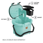 Kula 10 cooler in seafoam with accessories being place inside cooler
