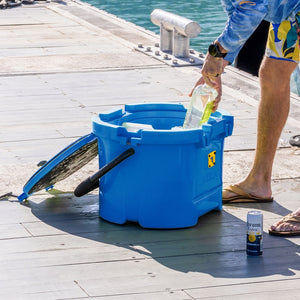A person placing drinks into the KULA 10 MAGNEPOD™ Cooler Harbor Blue