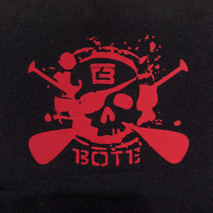 Closeup of red No Quarter Trucker Hat  with black background.