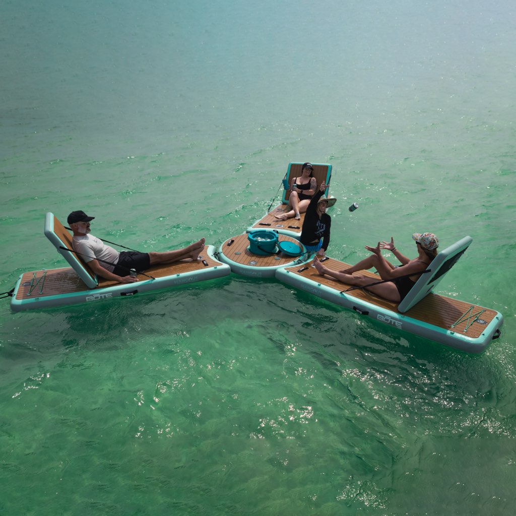 People lounging on the Inflatable Hangout Lounge Bar Trio
